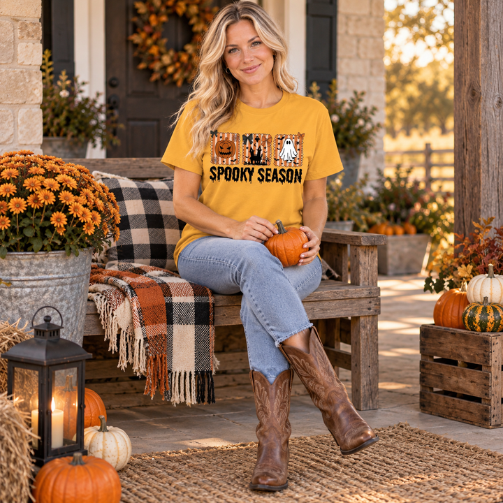 Woman wearing Spooky Season Squares Old Gold Halloween Tee in a Texas porch setting