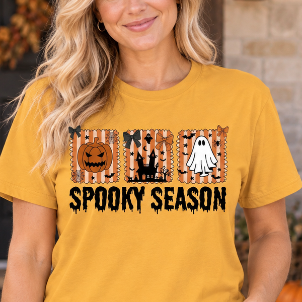 Woman modeling Spooky Season Squares Old Gold Halloween Tee, complete front view