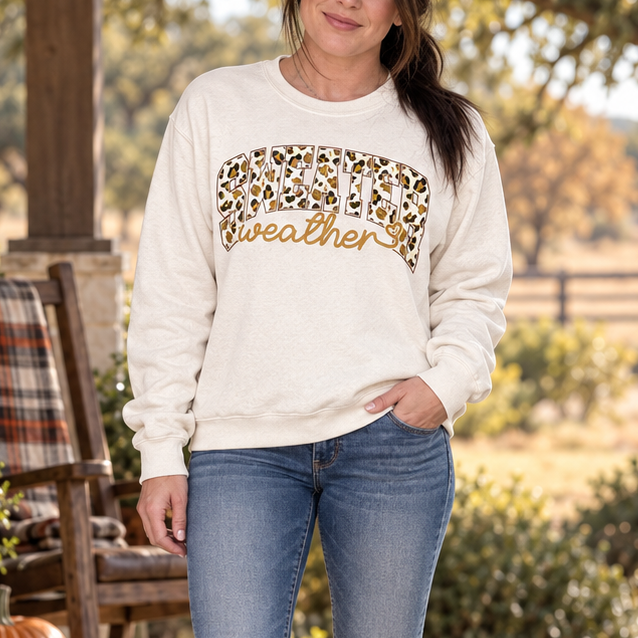 Full-body brunette wearing Sweater Weather Leopard beige crewneck in a Central Texas fall setting