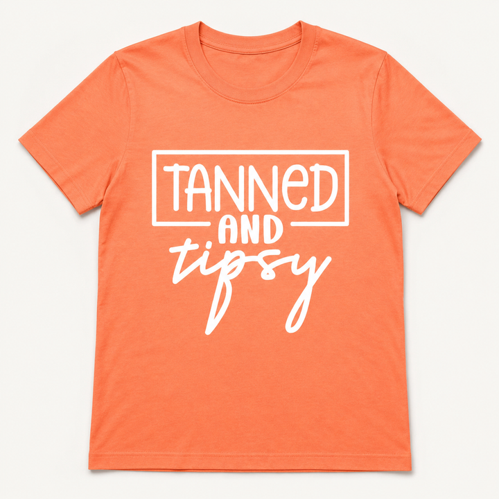 Tanned and Tipsy neon cantaloupe graphic tee on a clean studio background