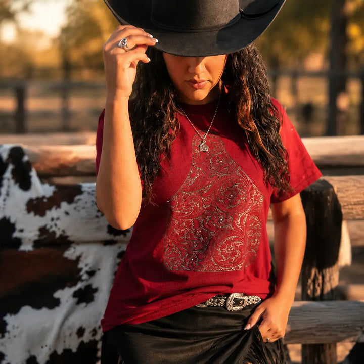 Tooled Cow Tag Western graphic tee in a ranch lifestyle setting