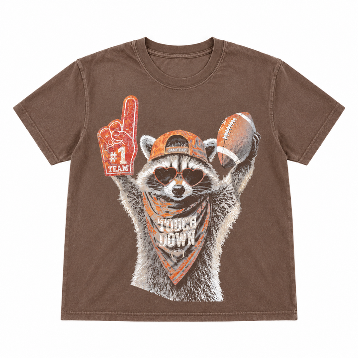 Touchdown Raccoon espresso football graphic tee single-garment lay-flat on pure white