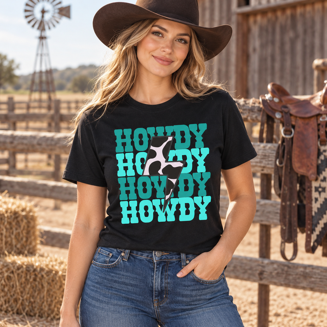 Woman wearing Turquoise Howdy Bolt Black Western graphic T-shirt