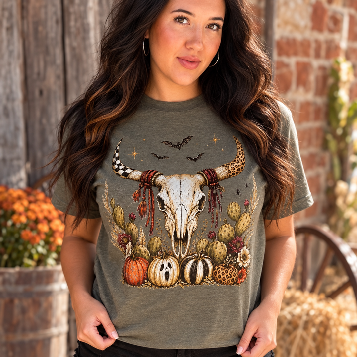 Western Fall Bull Skull graphic tee close model view by a small-town Western building