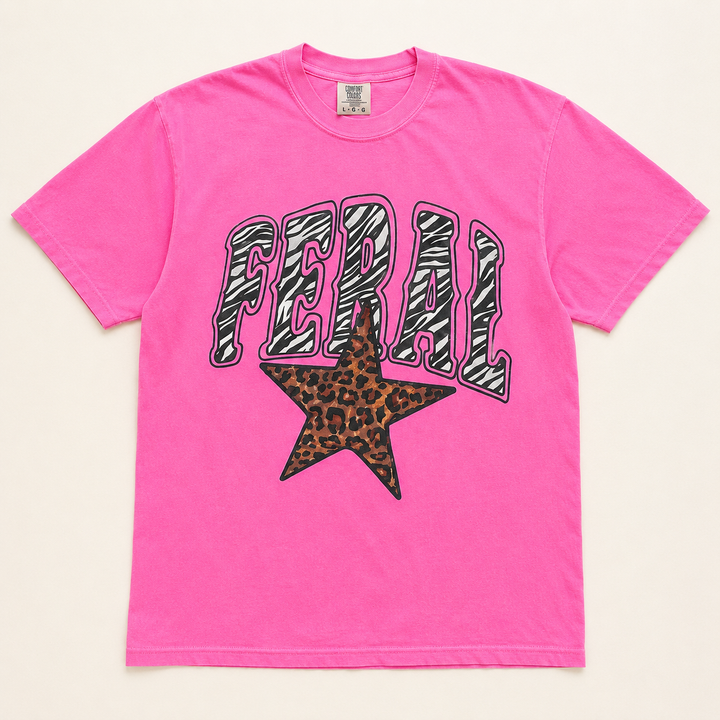 Neon pink Feral graphic tee with zebra lettering and leopard star, flat product view